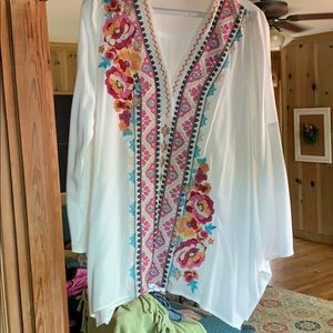 White blouse with embroidery.